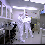 research technicians working in sterile environment